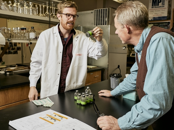 Luke McKay and Bill Inskeep examine samples of liquid from a Yellowstone hot spring.